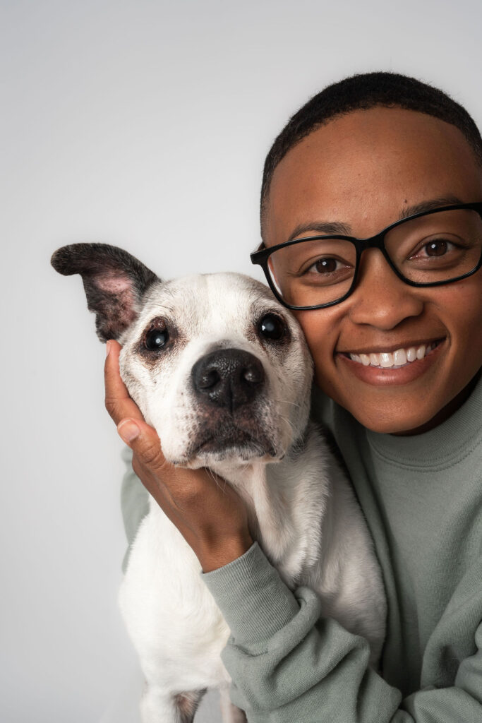 Dog and human portrait in a calm studio setting capturing connection and fine art style photography