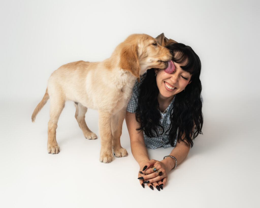 San Diego dog photographer capturing a couple with their dog in a studio portrait